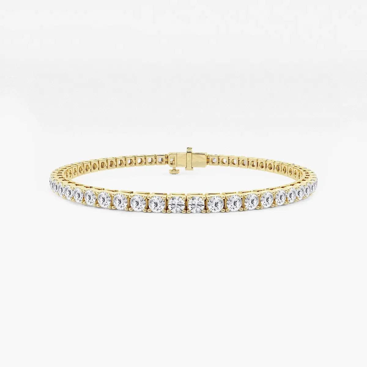Lab grown diamond tennis bracelet in yellow gold by Delux Jewelry on white background
