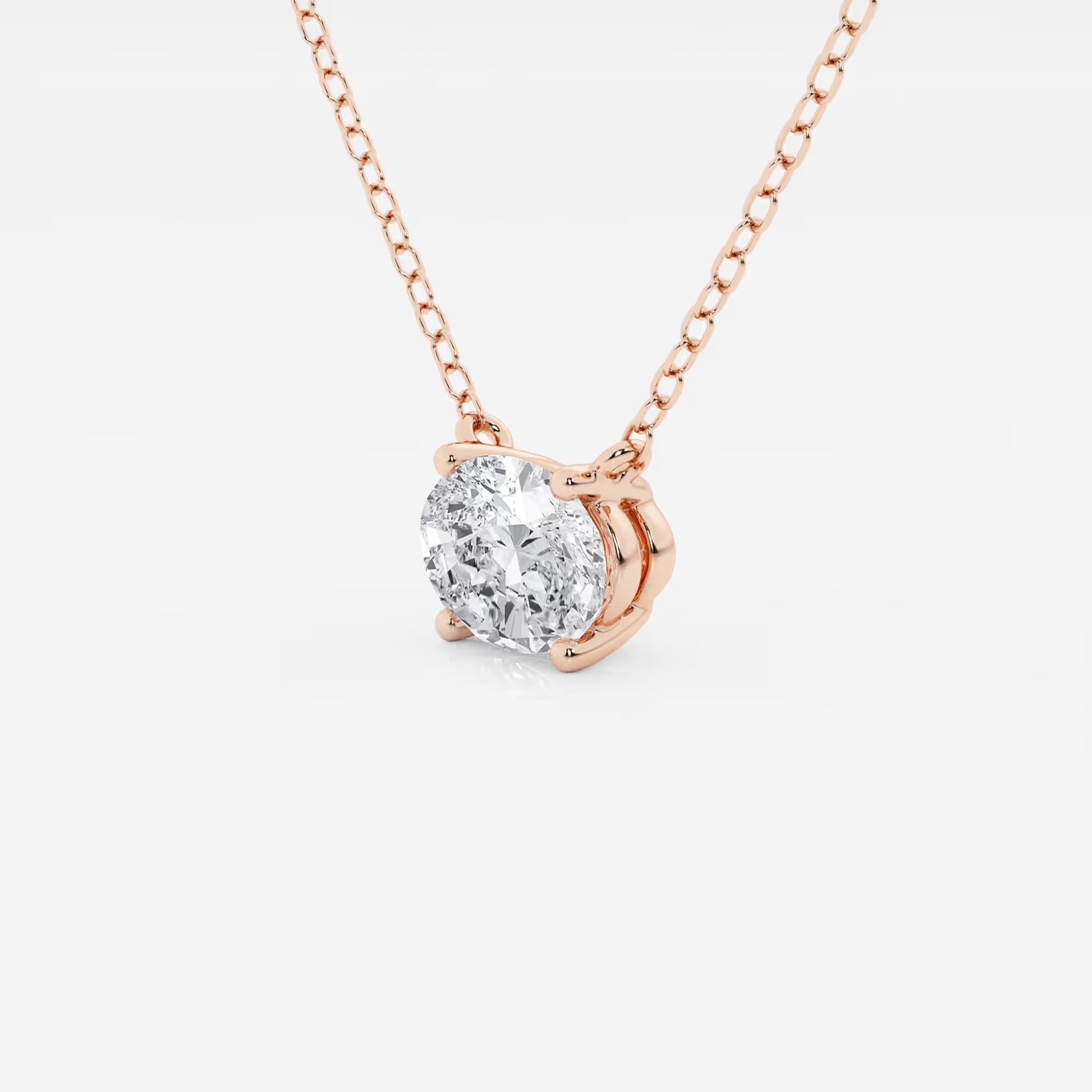 Oval lab grown diamond pendant necklace in rose gold setting by Delux Jewelry
