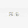Round lab grown diamond stud earrings in yellow gold setting on white background