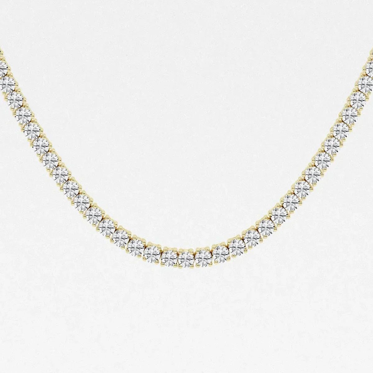 Close-up of a 20 inch lab diamond tennis necklace in 14K yellow gold from Delux Jewelry