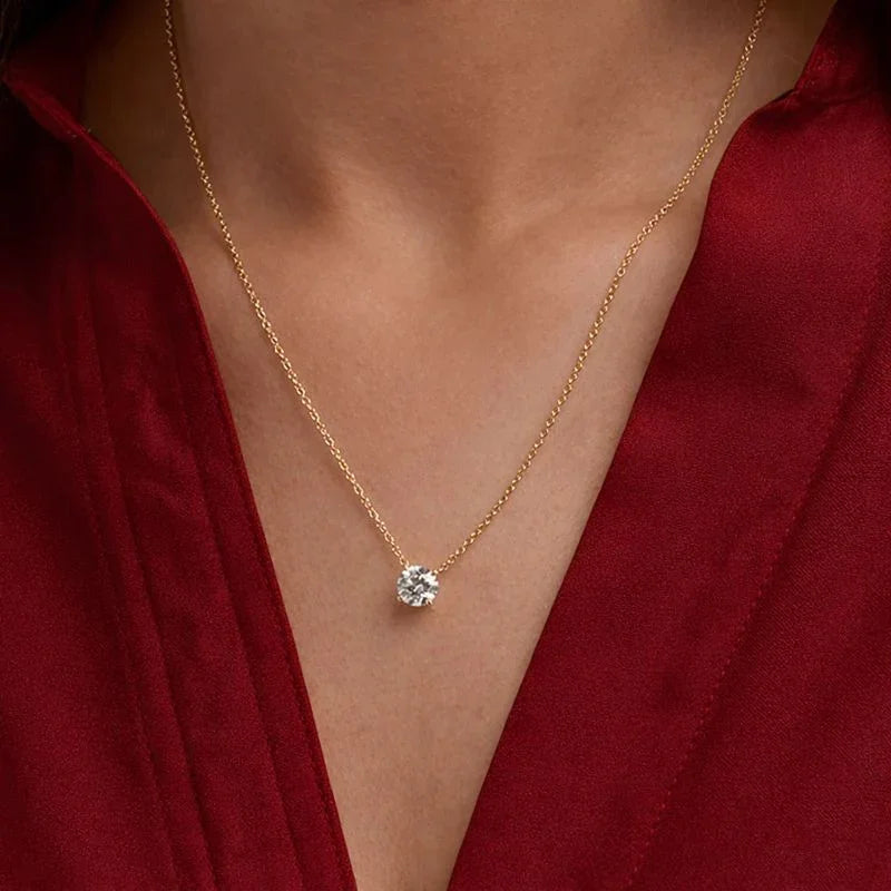 Round lab grown diamond pendant necklace on gold chain, worn with red blouse, Delux Jewelry