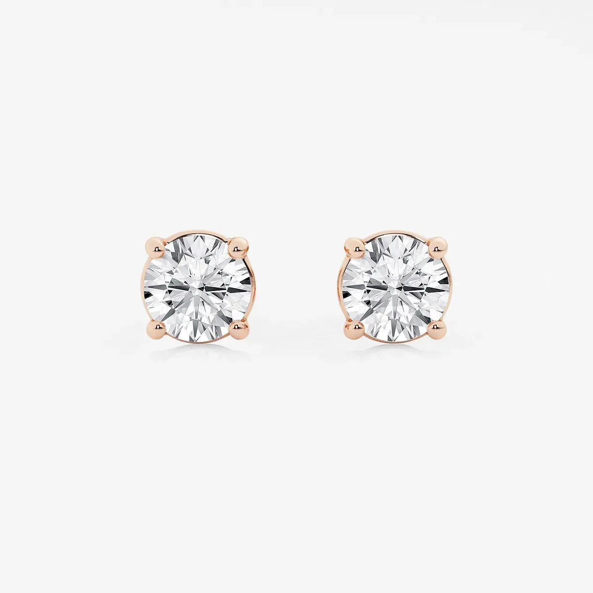 Round lab grown diamond stud earrings in rose gold setting on white background, Delux Jewelry