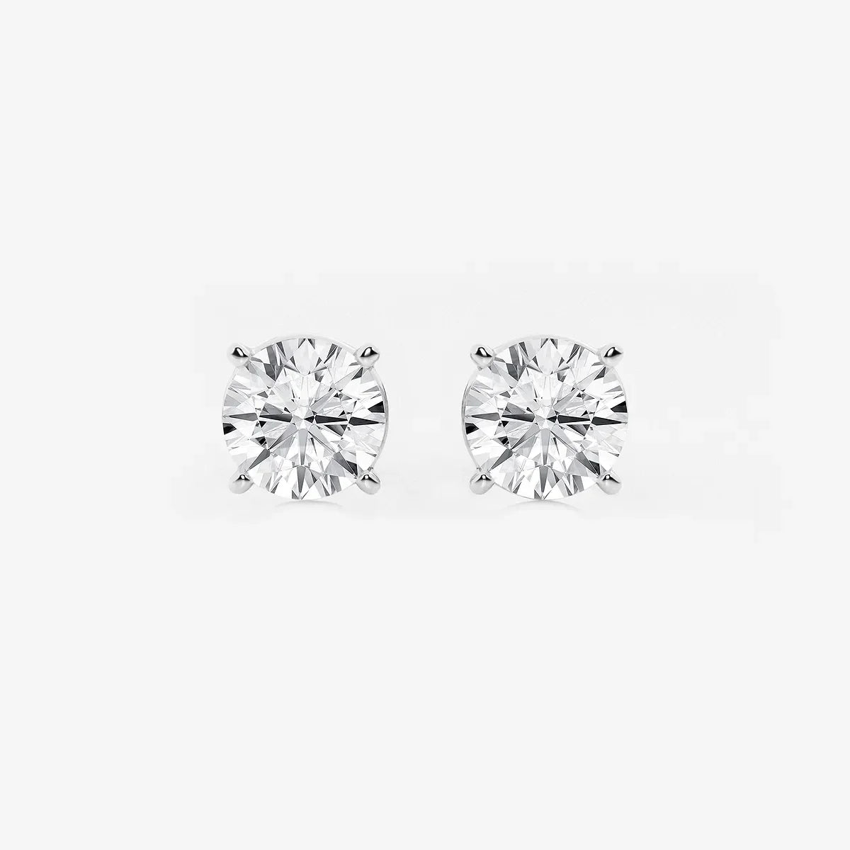 Round lab grown diamond stud earrings in white gold setting from Delux Jewelry