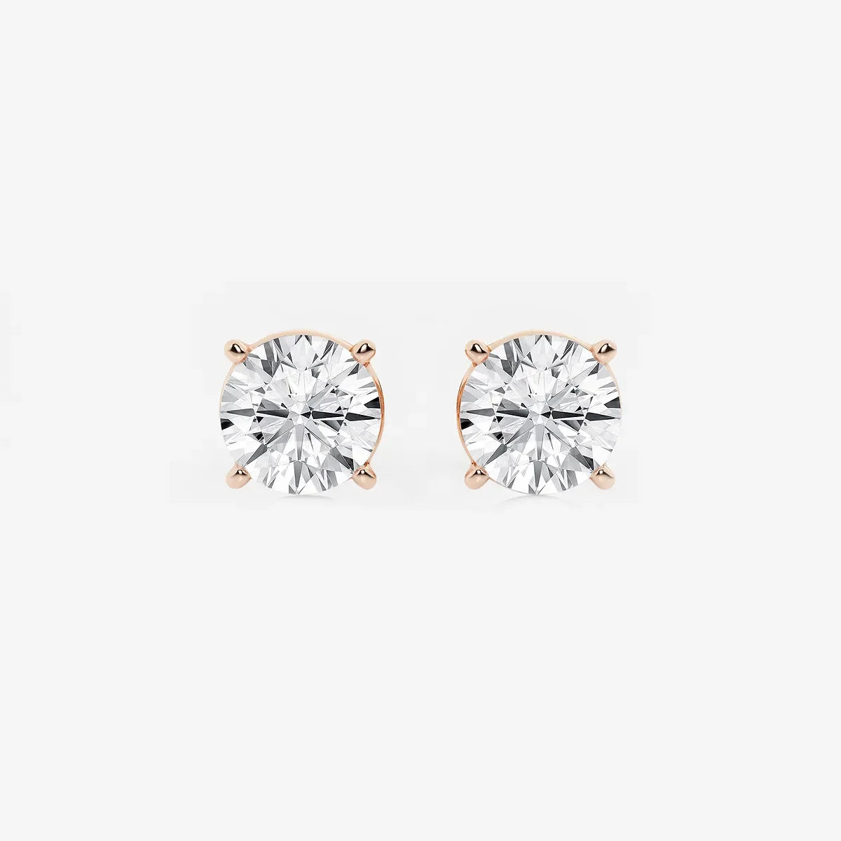 Round lab grown diamond stud earrings in rose gold prong setting, Delux Jewelry