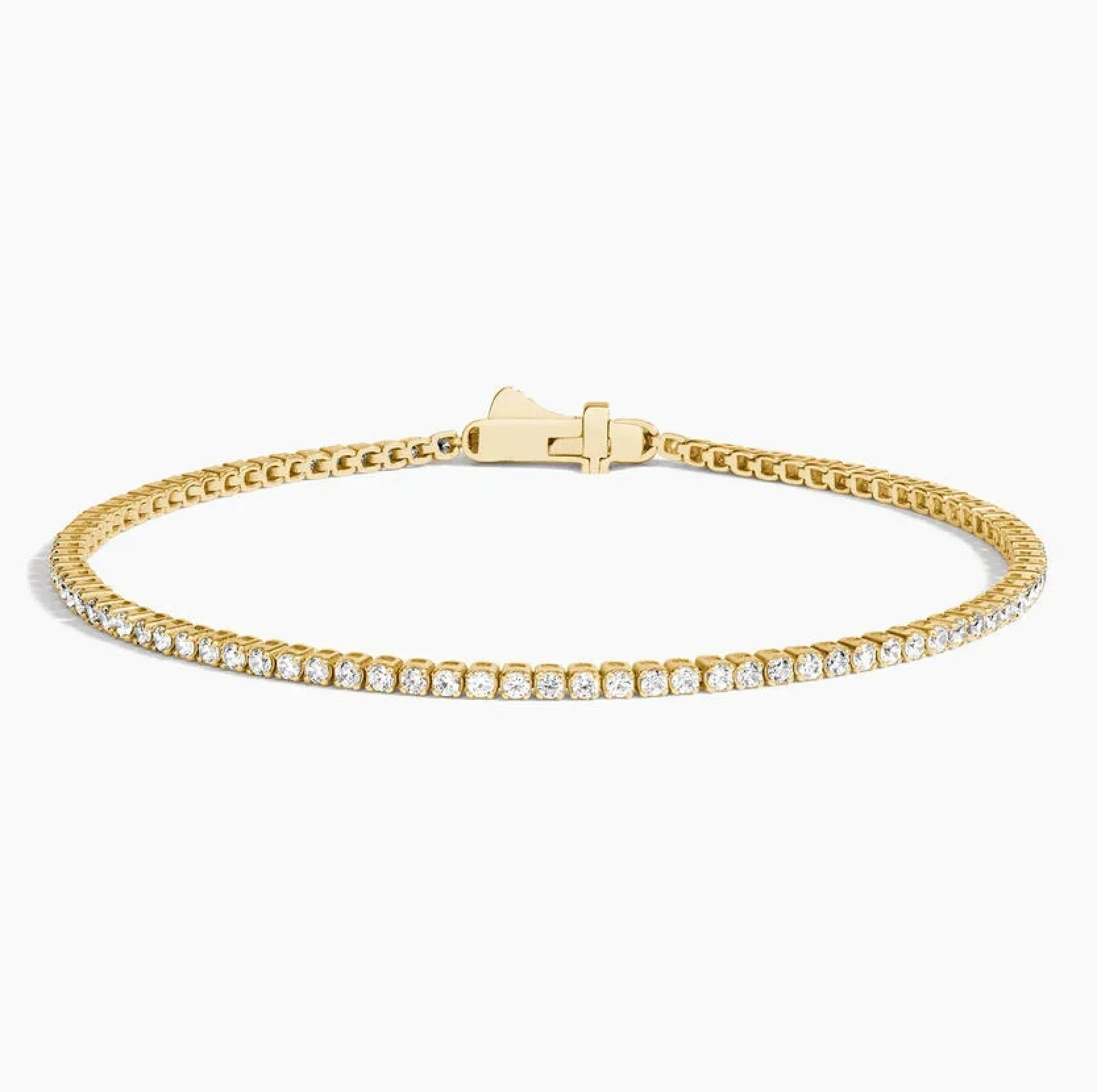 6.5 inch lab grown diamond tennis bracelet in 14K yellow gold with closed clasp on white background