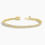 Lab grown diamond tennis bracelet in 14K yellow gold with open clasp on white background