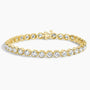 Lab grown diamond tennis bracelet in 14K yellow gold from Delux Jewelry, sparkling round stones
