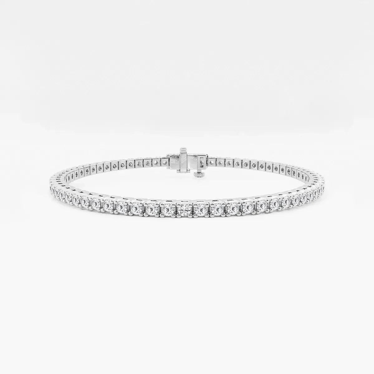 White gold tennis bracelet with lab grown diamonds on white background, Delux Jewelry