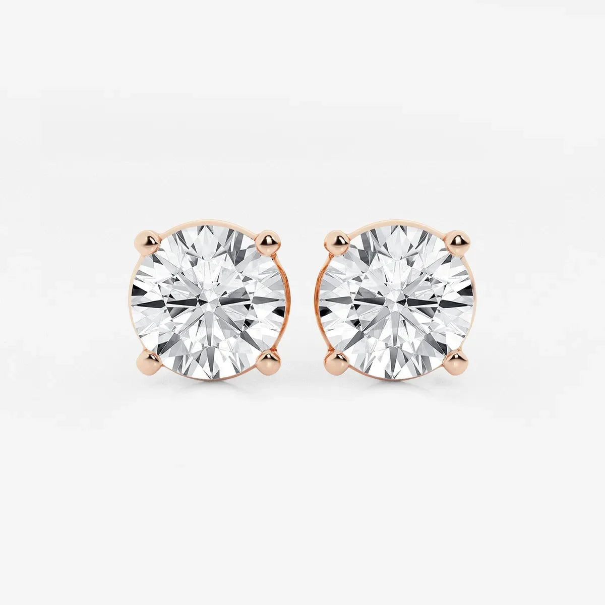 Round lab grown diamond stud earrings in rose gold prong setting, Delux Jewelry