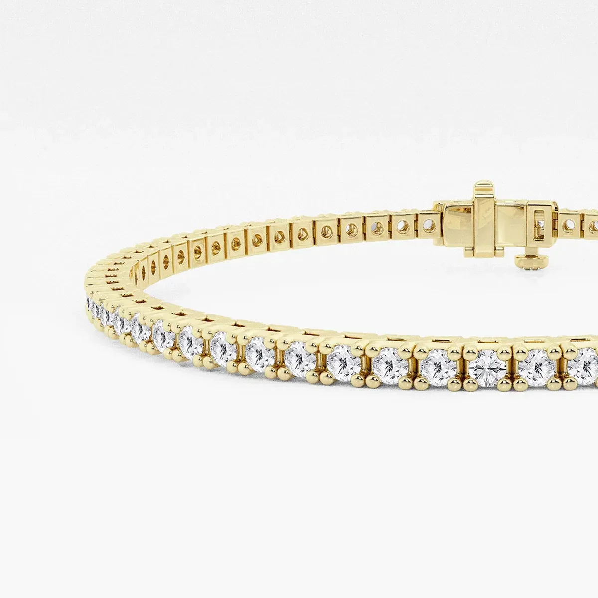 Yellow gold lab grown diamond tennis bracelet from Delux Jewelry on white background
