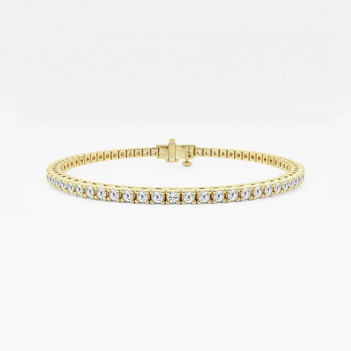 Yellow gold tennis bracelet with lab grown diamonds by Delux Jewelry on white background