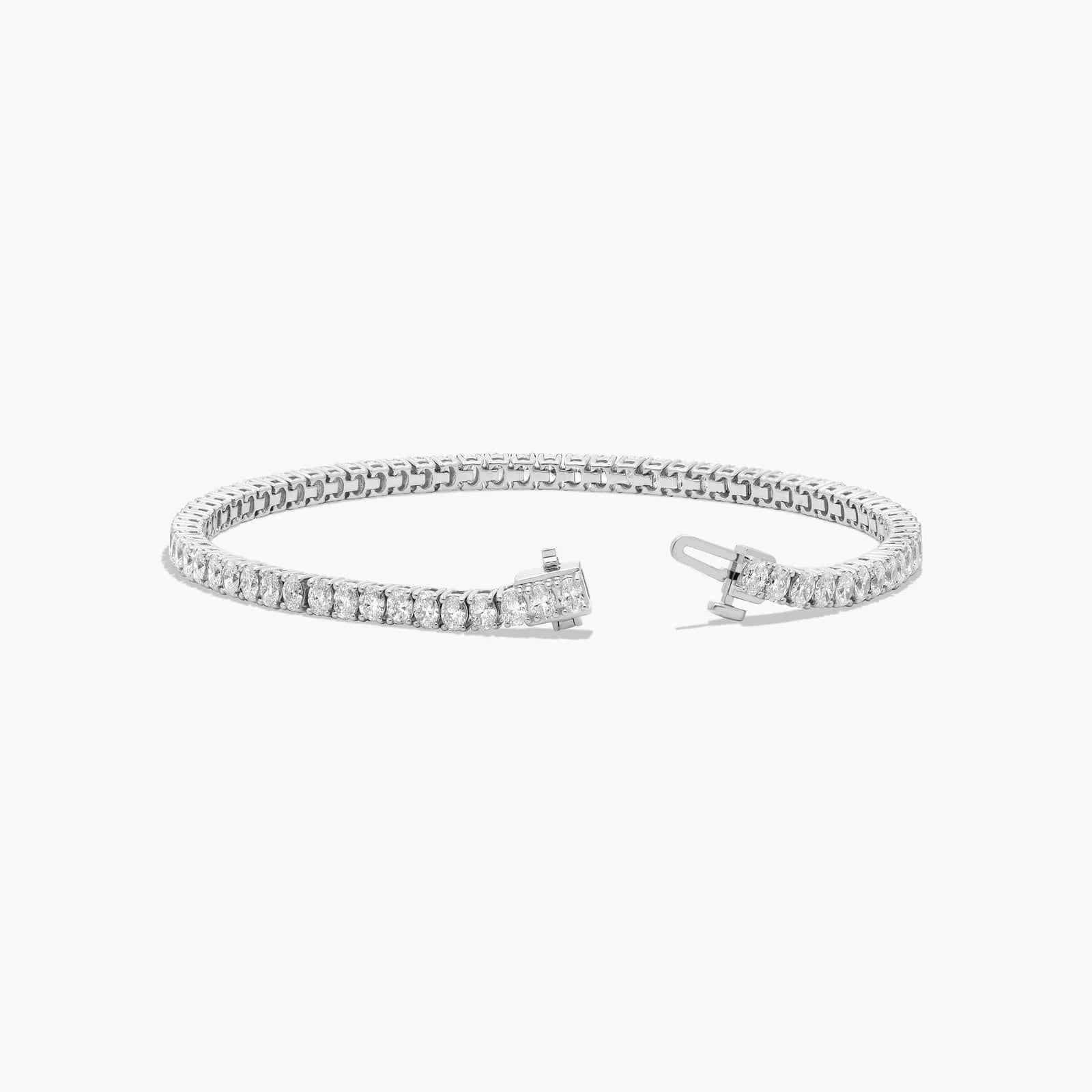 Oval cut lab diamond tennis bracelet in 14K white gold with open clasp, Delux Jewelry