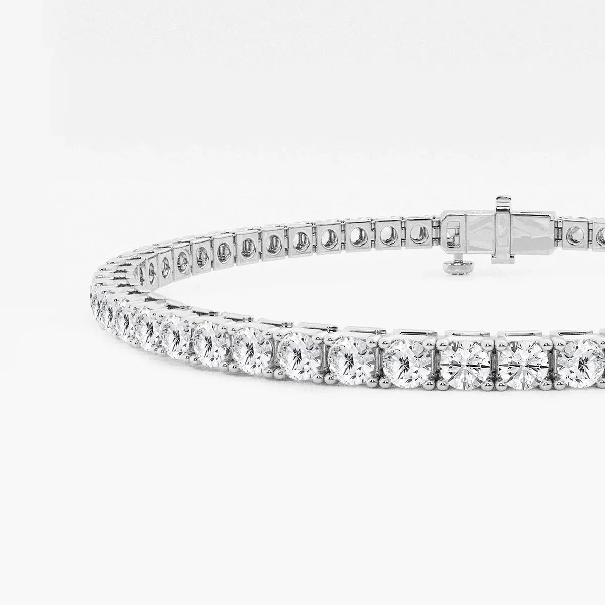 White gold tennis bracelet with round lab grown diamonds on white background, Delux Jewelry