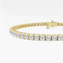 Lab grown diamond tennis bracelet in yellow gold by Delux Jewelry on white background
