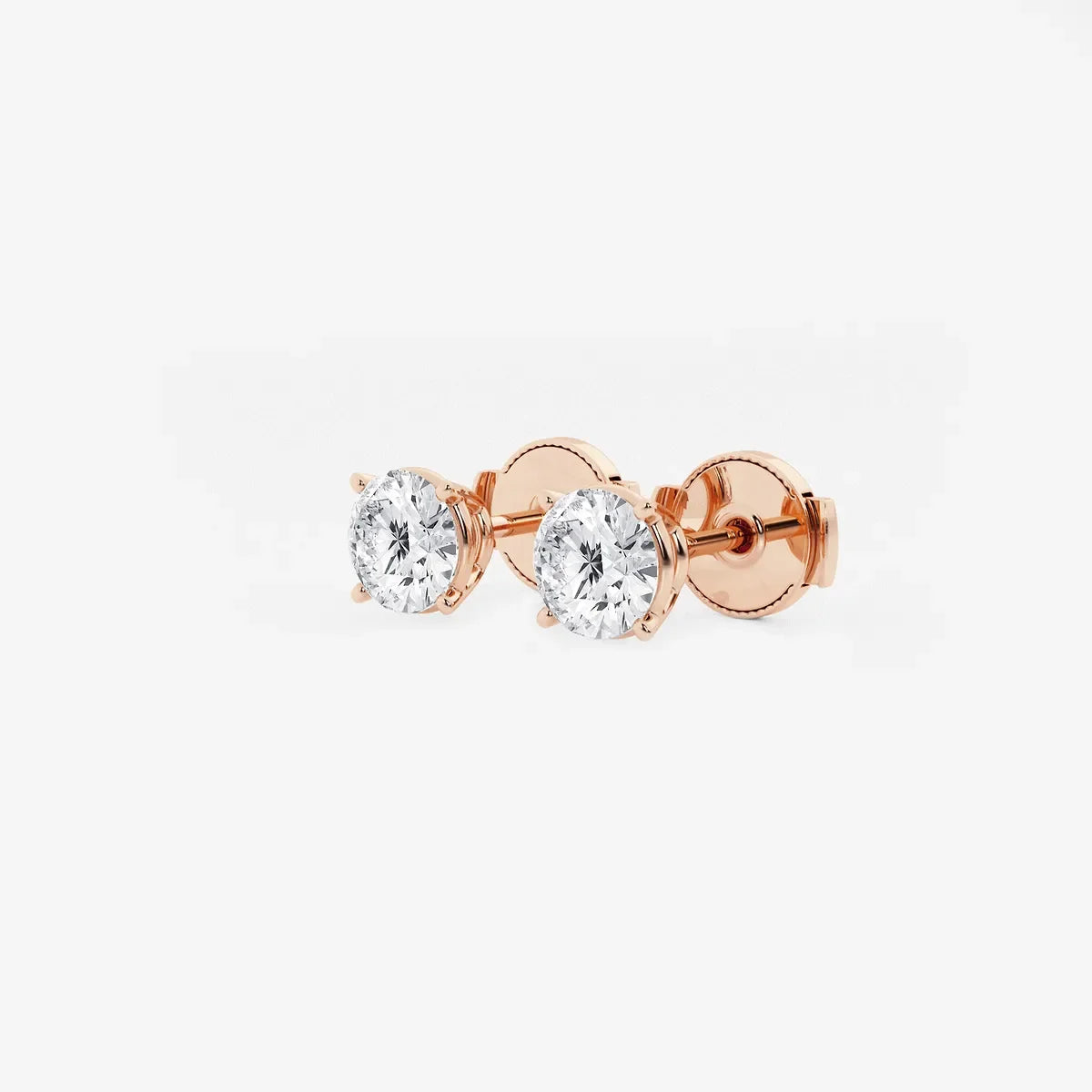 Round lab grown diamond stud earrings in rose gold setting from Delux Jewelry