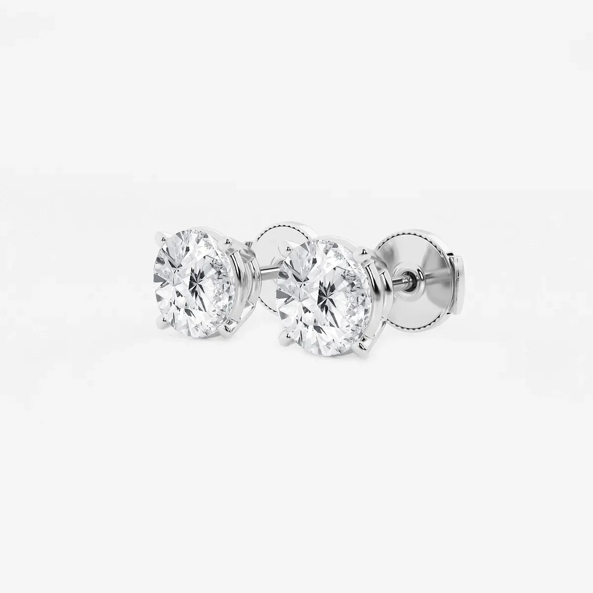 Round lab grown diamond stud earrings in white gold setting on white background