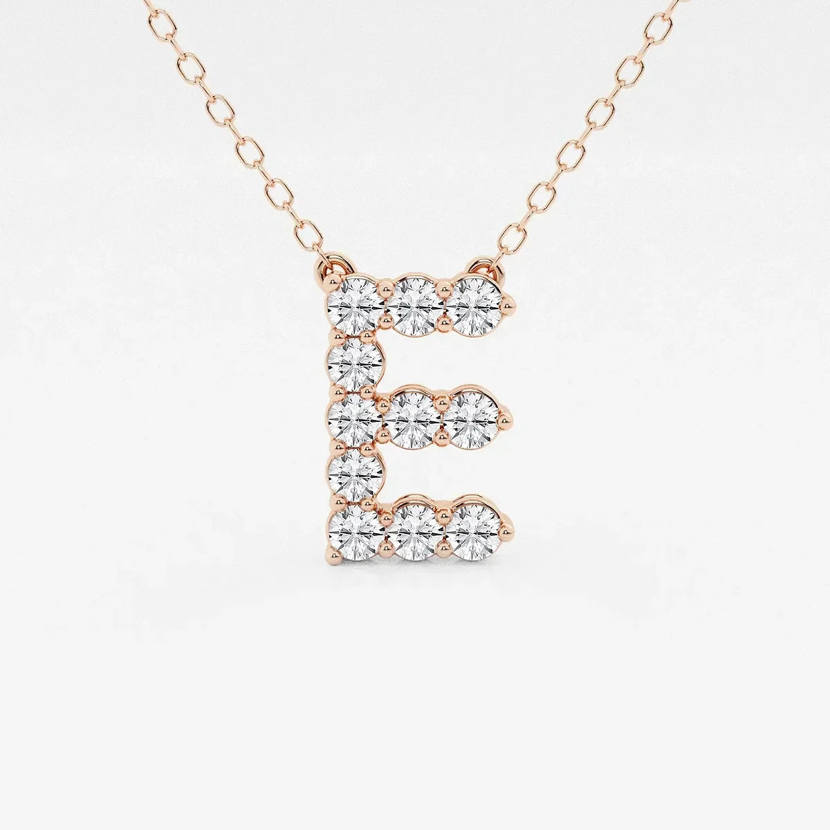 Rose gold pendant necklace with lab grown diamond letter E from Delux Jewelry