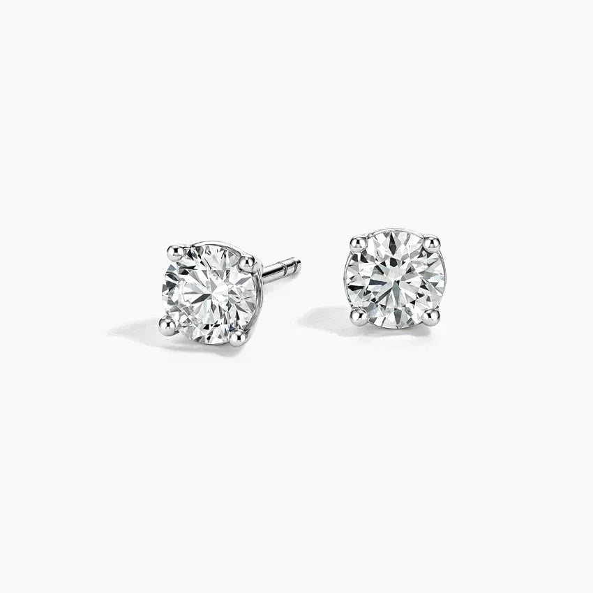 Pair of lab grown diamond stud earrings in 14K white gold on white background, Delux Jewelry