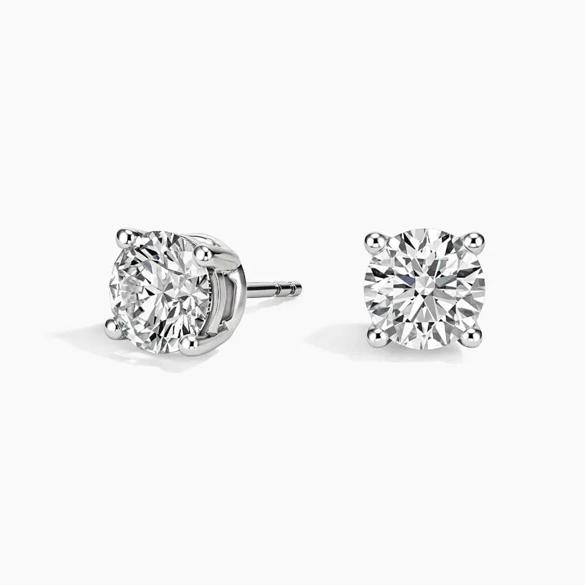 Lab diamond stud earrings in 14K white gold by Delux Jewelry on white background
