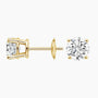 Lab grown diamond stud earrings in 14K yellow gold from Delux Jewelry on white background