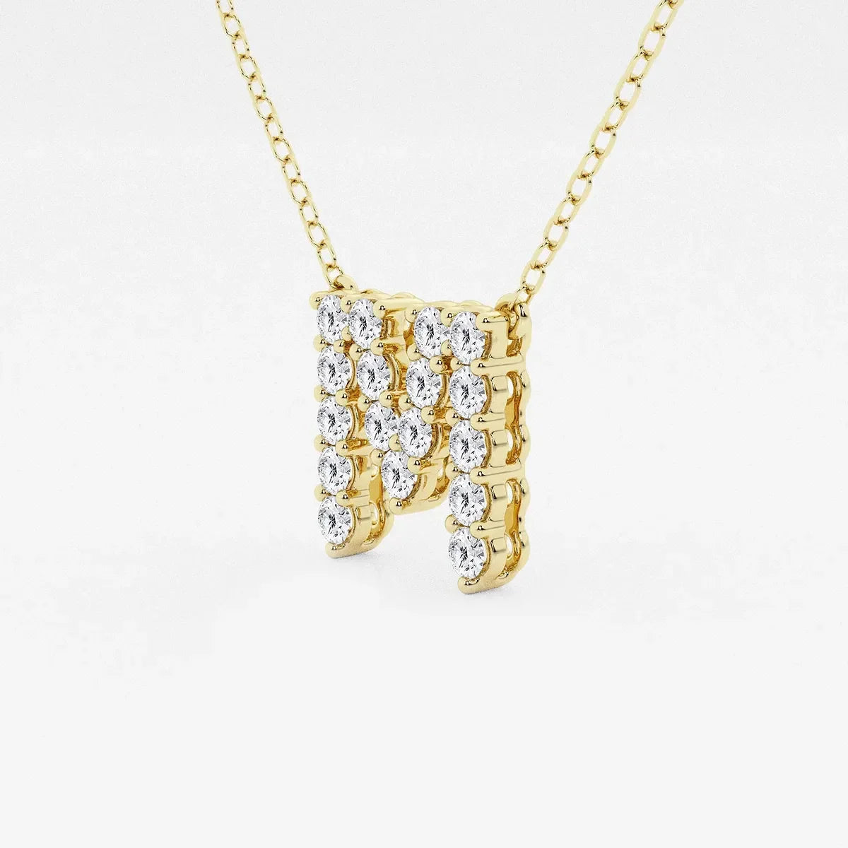 Yellow gold letter M pendant necklace with lab grown diamonds by Delux Jewelry