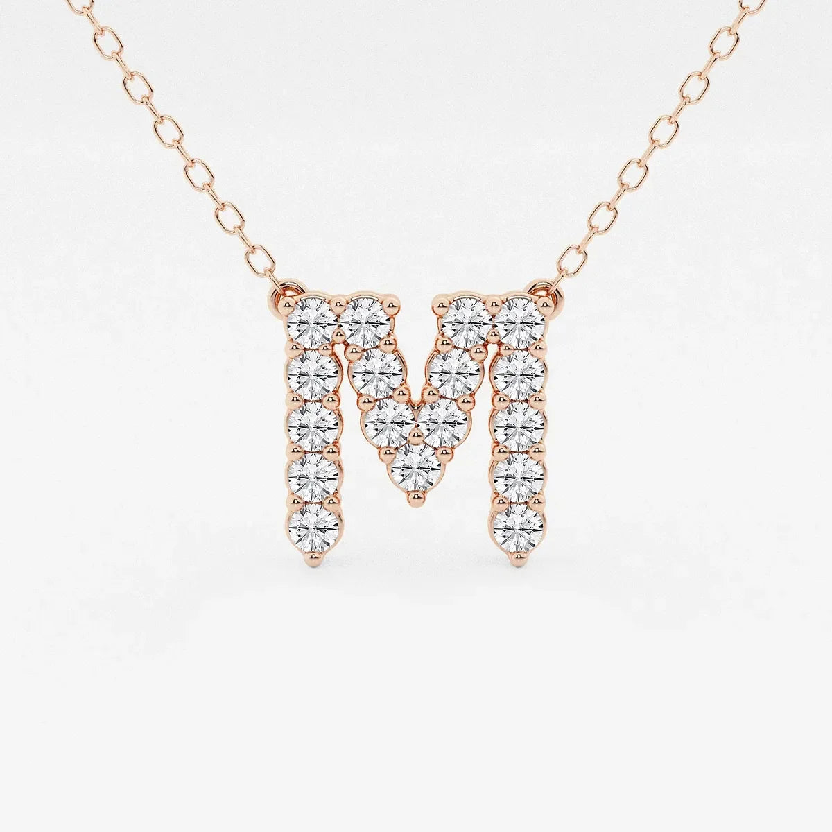 Rose gold necklace with lab grown diamond M initial pendant from Delux Jewelry