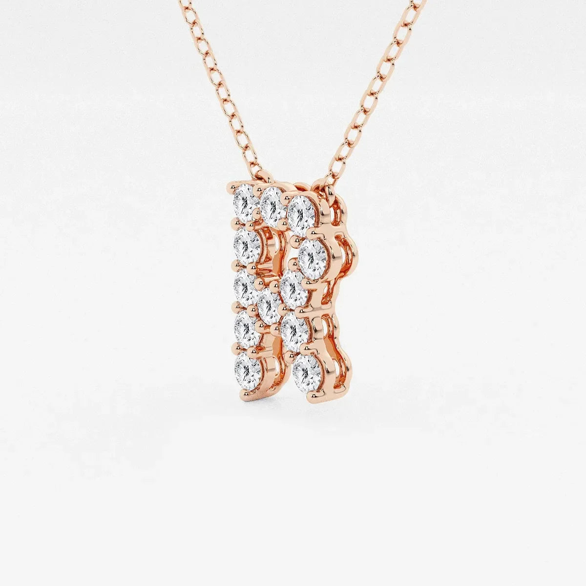 Rose gold pendant necklace with lab grown diamonds in the shape of letter R by Delux Jewelry