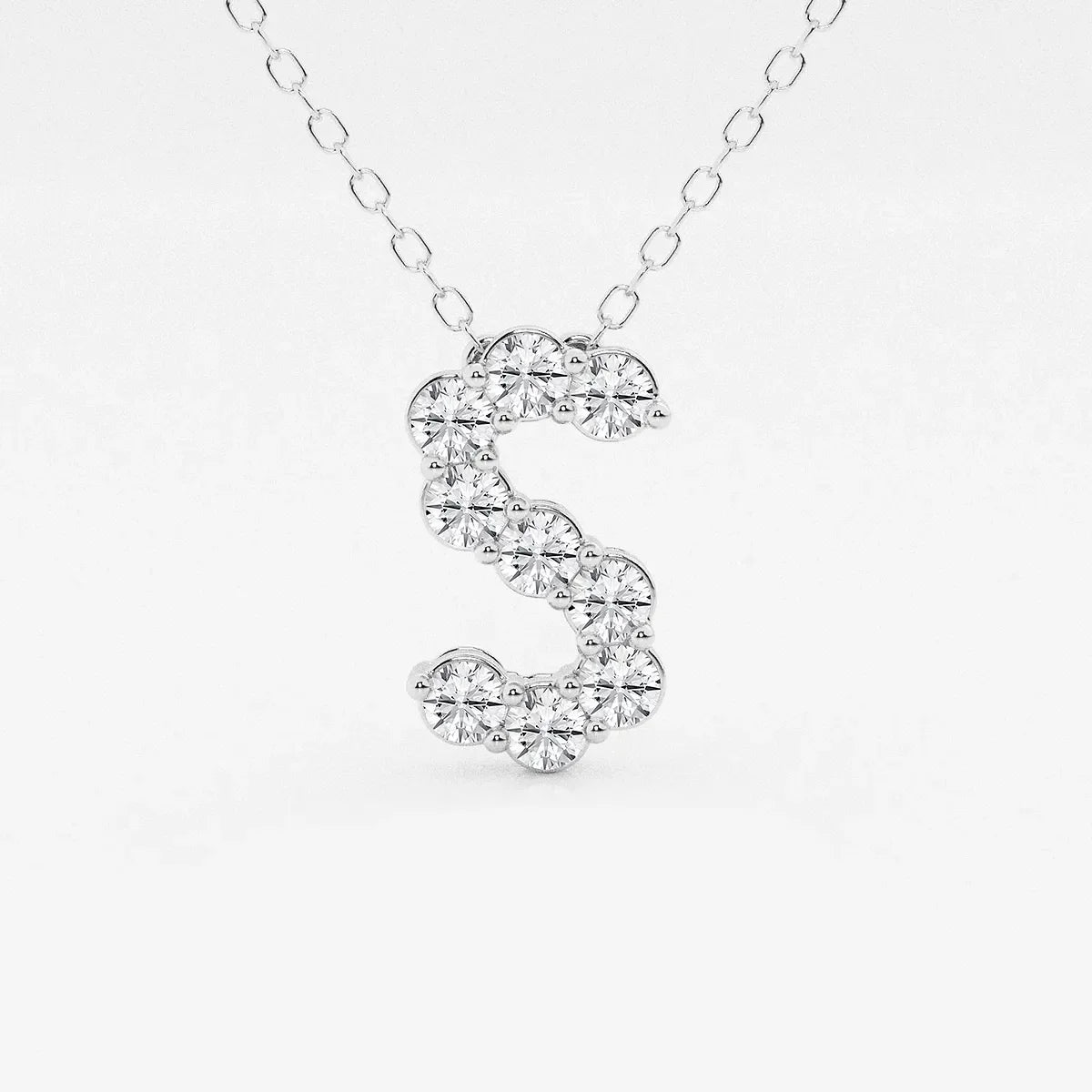 White gold necklace with S-shaped pendant set with lab grown diamonds from Delux Jewelry