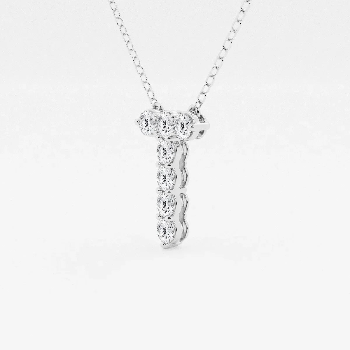 White gold pendant necklace with lab grown diamonds from Delux Jewelry on plain background