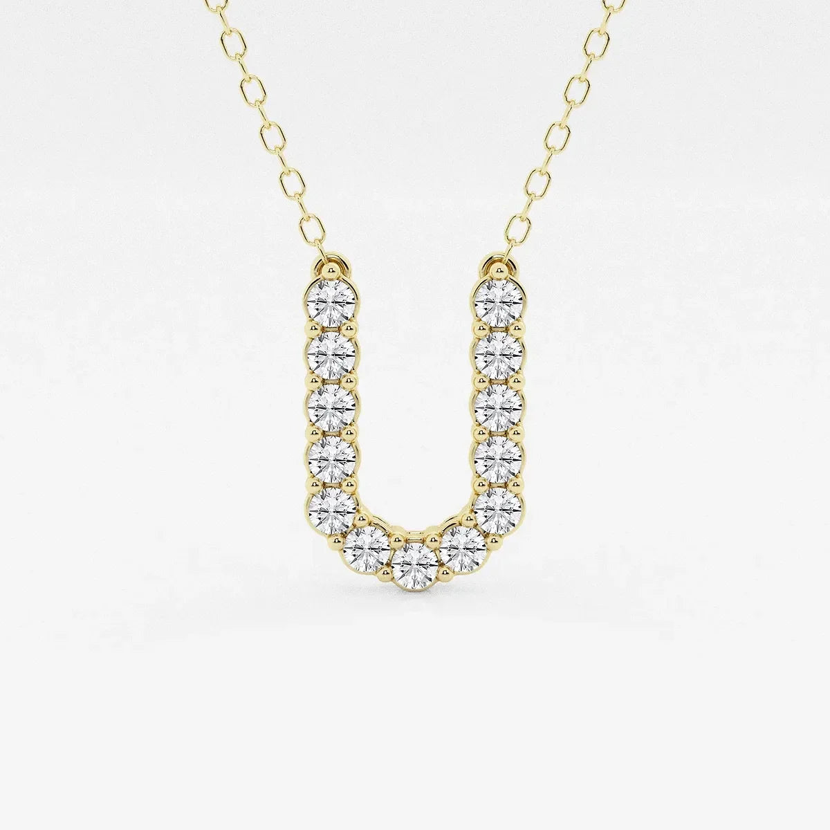 Gold pendant necklace with U-shaped lab grown diamonds from Delux Jewelry
