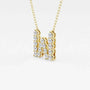 Yellow gold necklace with lab grown diamond letter W pendant on white background