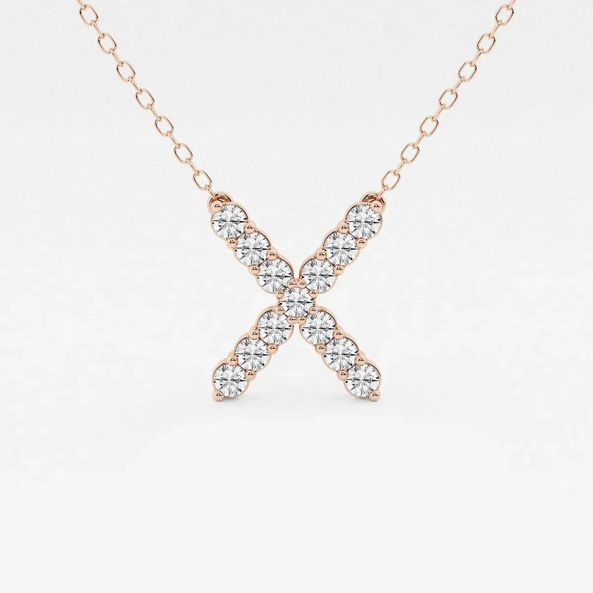 Rose gold X pendant necklace with lab grown diamonds on a delicate chain, Delux Jewelry